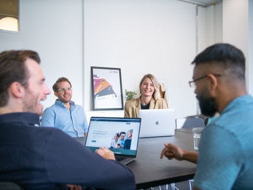 Employees with laptops