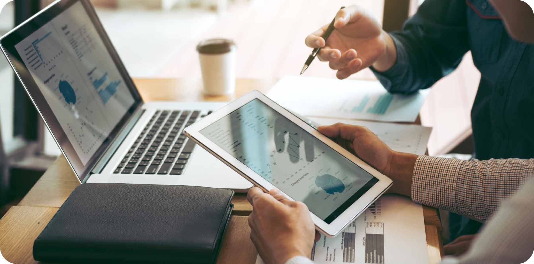 Two people using their devices for work purposes