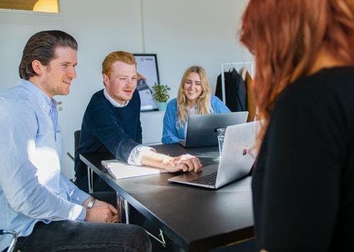 Employees with laptops