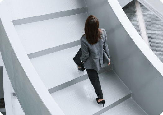 A woman walking up the stairs