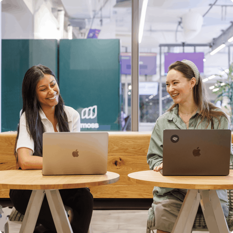 Moss employees with their laptops